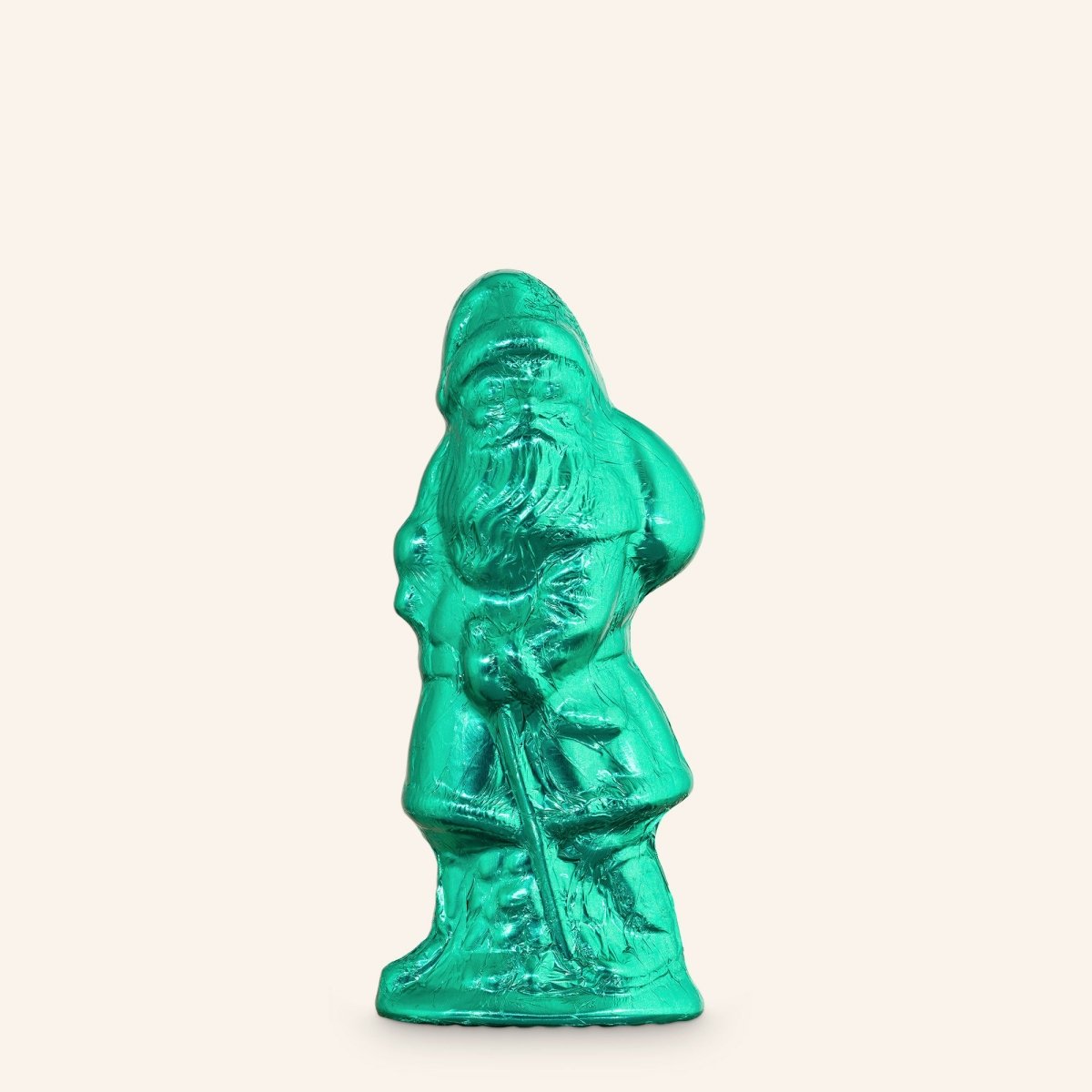 Schokoladenfigur in Form eines Weihnachtsmanns, eingewickelt in grüne Stanniolfolie.
