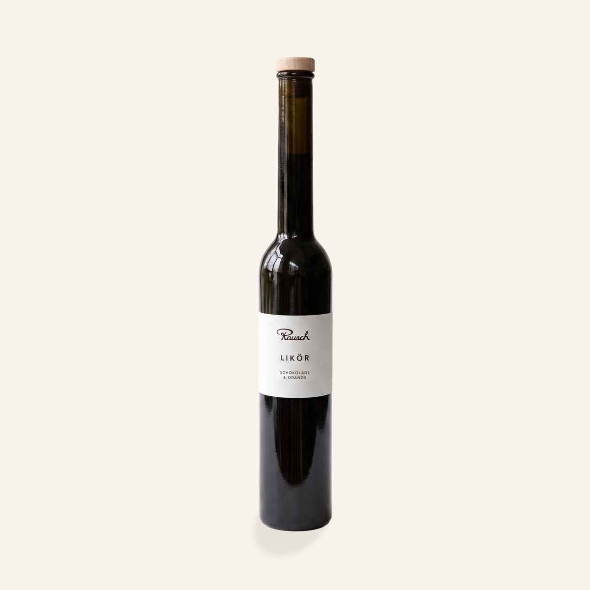 Dunkelbraune, schlanke Flasche mit hellem Etikett, handwerklicher Schoko Orange Likör. - Rausch