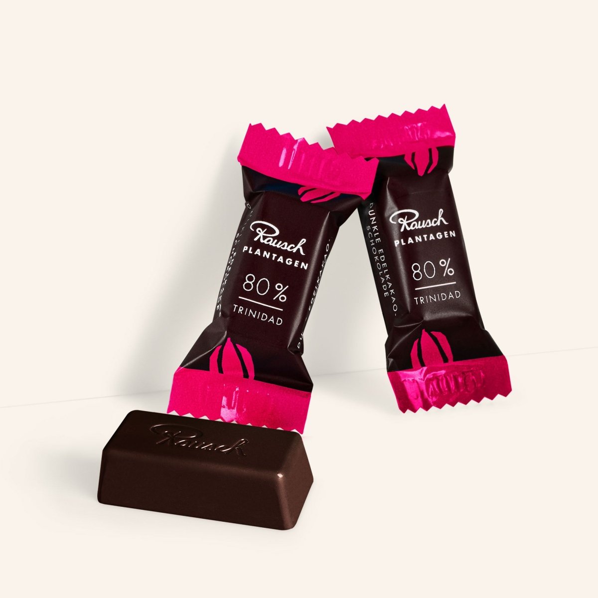 Dunkle Schokoladenminis von Rausch, Trinidad 80 %, in pink-schwarzer Verpackung.