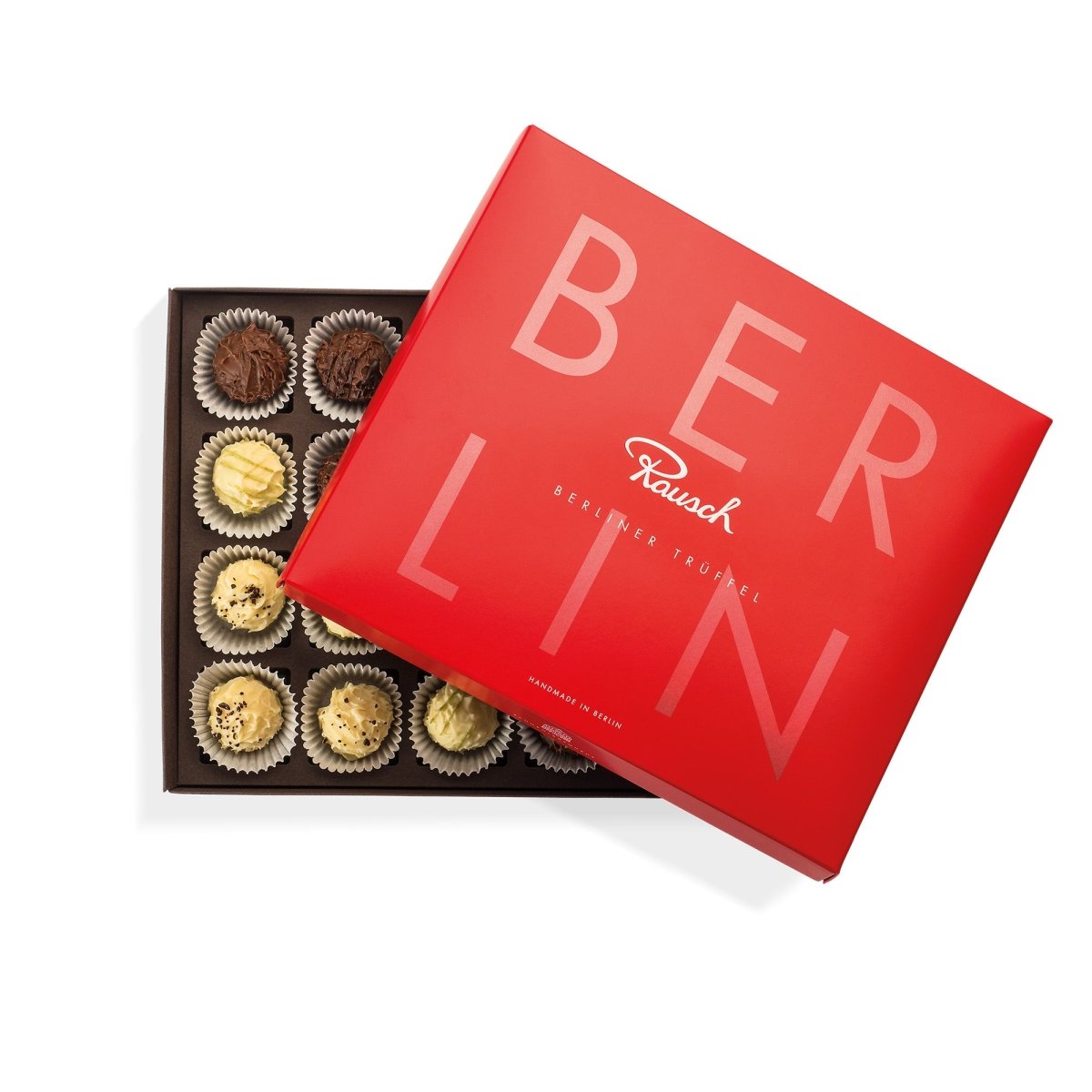 Offene rote Pralinenschachtel mit 20 Berliner Trüffeln von Rausch, elegant arrangiert.