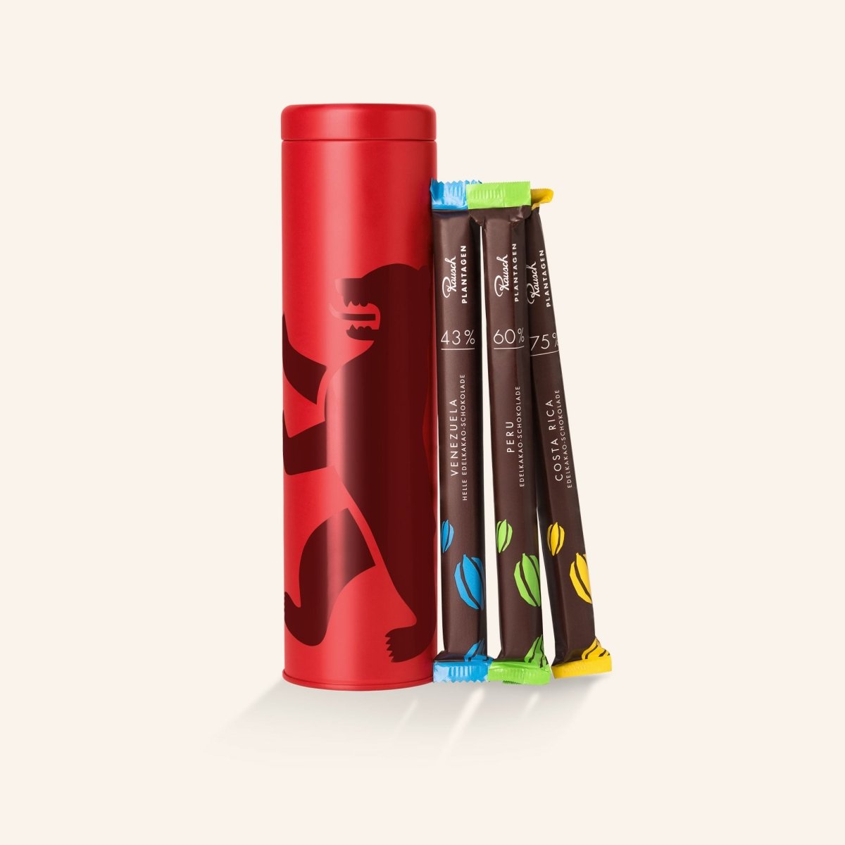Rote Dose von Rausch mit vier Schokoladensticks in verschiedenen Geschmacksrichtungen daneben.