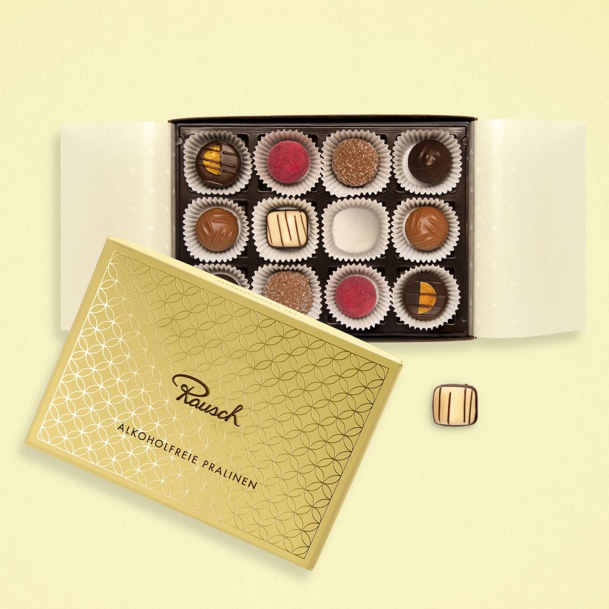 Elegante gelbe Pralinenschachtel mit 12 alkoholfreien Pralinen in verschiedenen Geschmacksrichtungen.