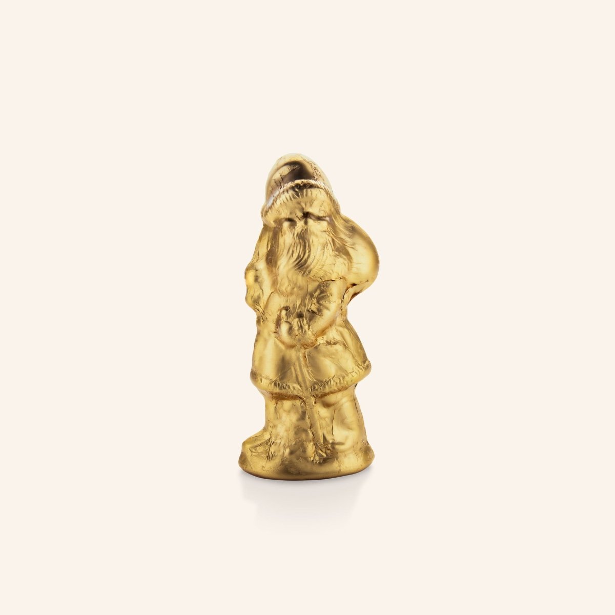 Goldener Schokoladen-Weihnachtsmann von Rausch vor neutralem Hintergrund.