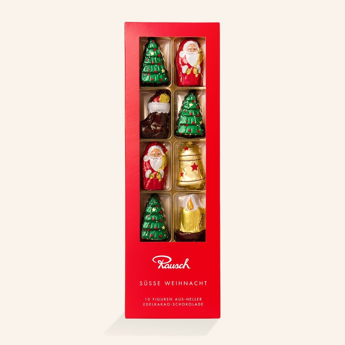 Rote Geschenkschachtel mit 10 weihnachtlichen Edel-Schokoladenfiguren: Tannenbäume, Weihnachtsmänner und Glocken.