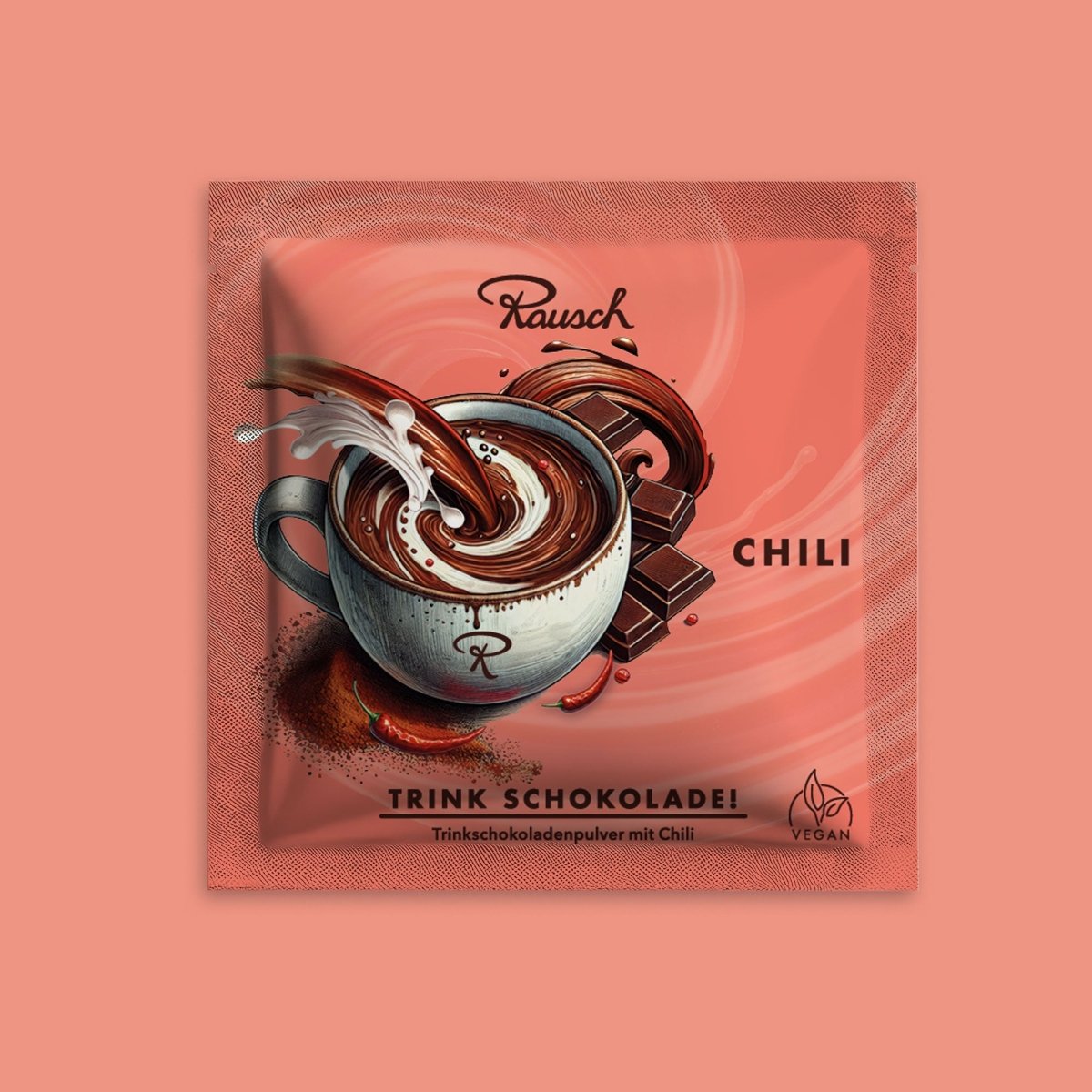 Rausch Trinkschokolade mit Chili, Schokoladenpulver in illustrativer Verpackung mit Tasse und Schokoladenstücken.