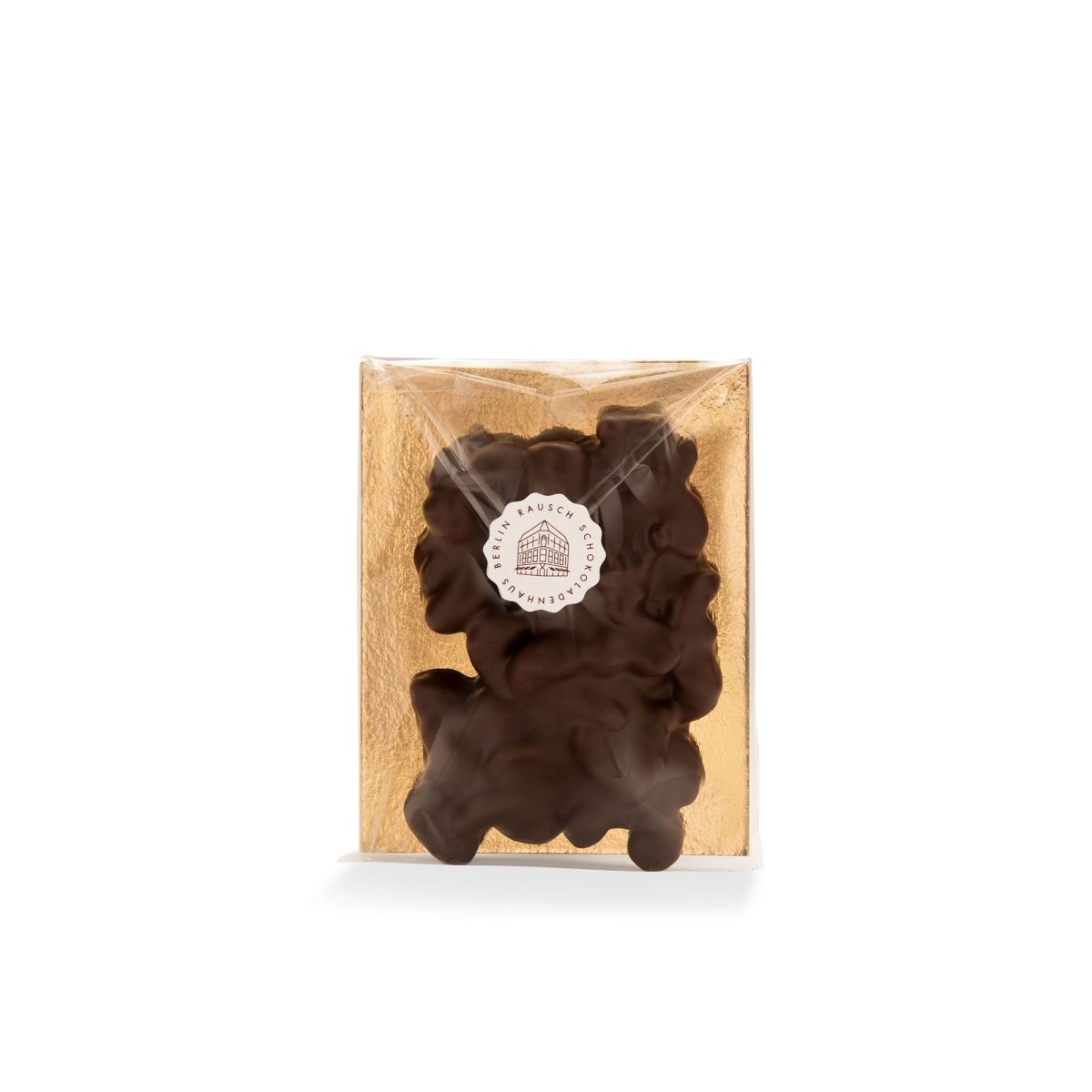Verpackte dunkle Schokolade mit Cashew-Nüssen von Rausch, edel präsentiert auf goldenem Hintergrund.