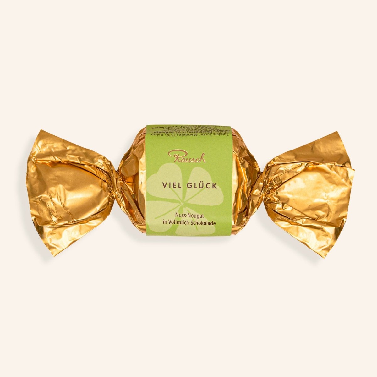 Goldener Happen "Viel Glück" mit Nuss-Nougat in Vollmilch-Schokolade, umhüllt von glänzendem Papier.