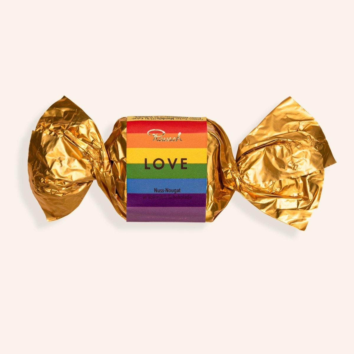 Nougathappen in goldener Folie mit Regenbogenpapier und dem Wort "LOVE".