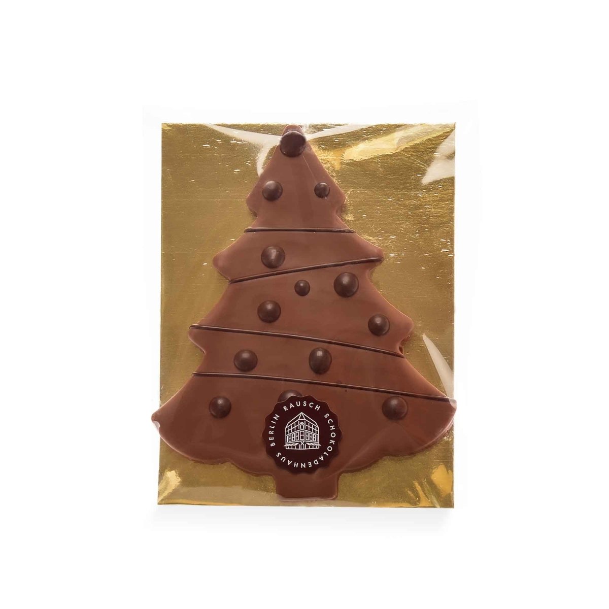 Schokoladenbaum aus heller Schokolade mit Pralinen auf goldener Verpackung von Rausch.