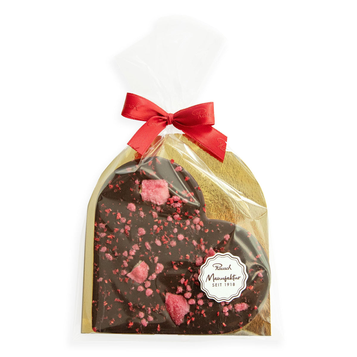 Schokoladenherz mit Rosenblättern, verpackt in Folie mit roter Schleife, von Rausch Manufaktur.